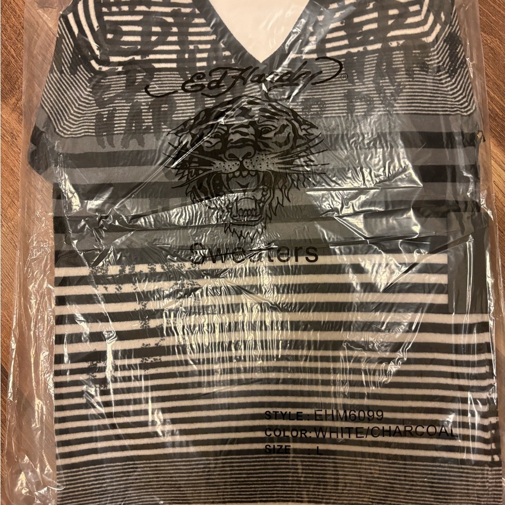 Ed Hardy sweater size large . Brand new in package .
